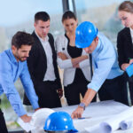 business people and construction engineers on meeting