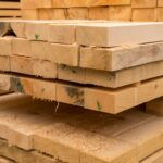 young-male-architecture-writing-on-clipboard-at-construction-site_23-2148204019